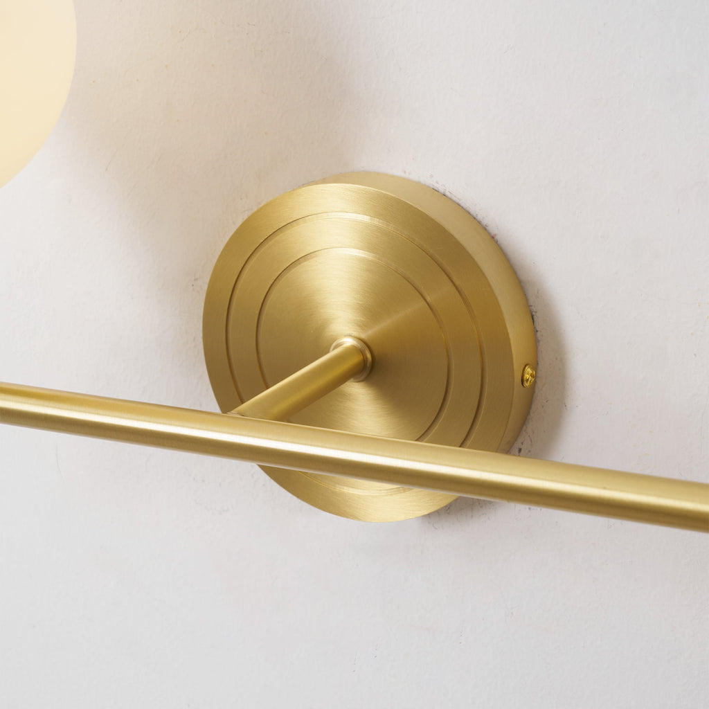 Holten Brass Armed Sconce — Two White Glass Globes