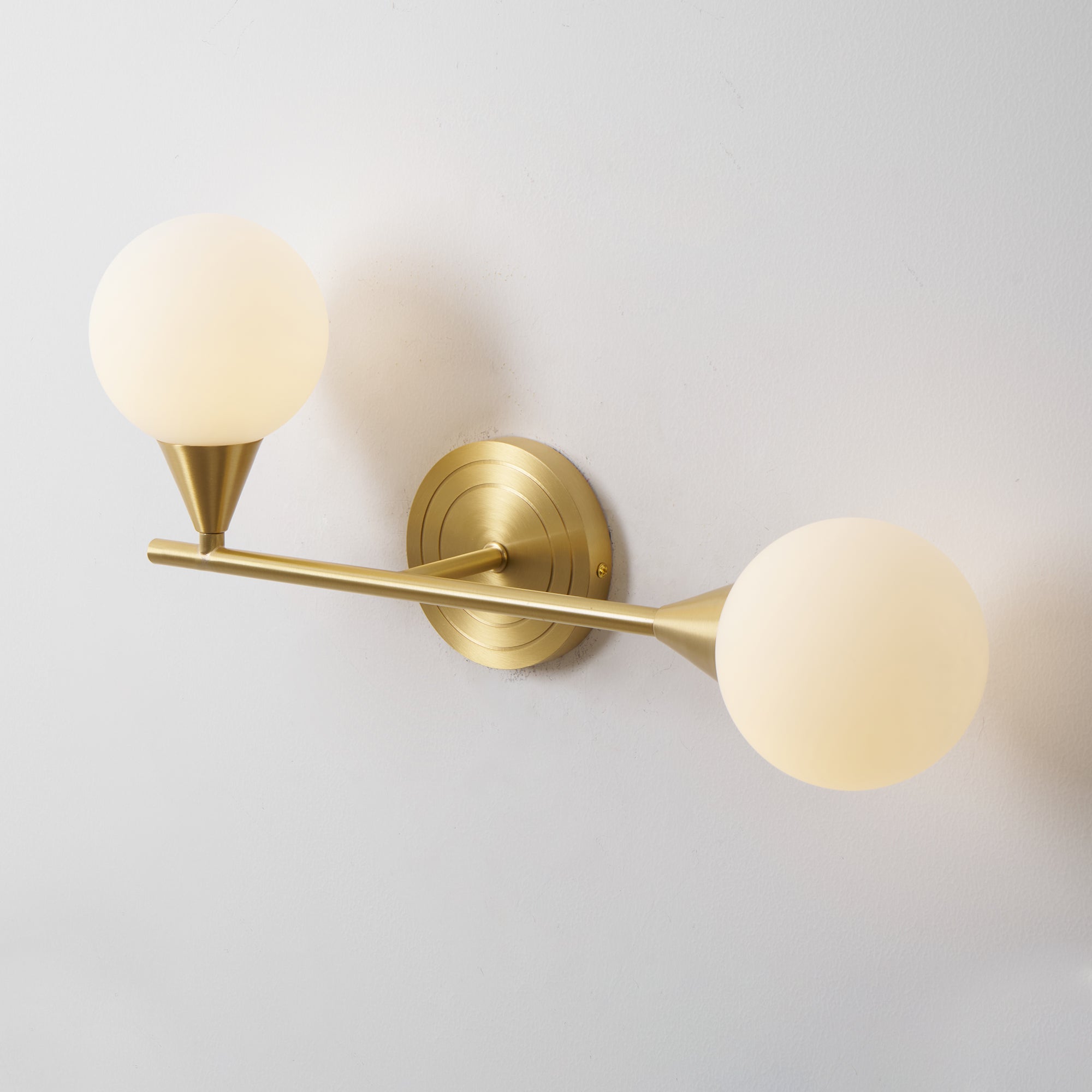 Holten Brass Armed Sconce — Two White Glass Globes