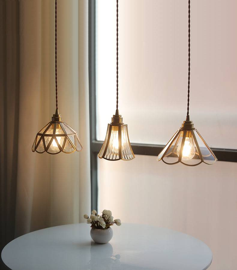 Elara messing hanglamp - heldere glazen kap, gedraaid snoer - Desfino