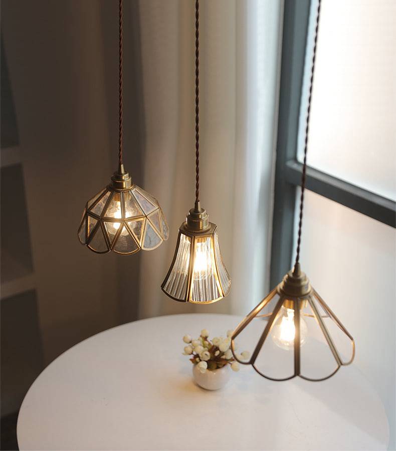 Elara messing hanglamp - heldere glazen kap, gedraaid snoer - Desfino