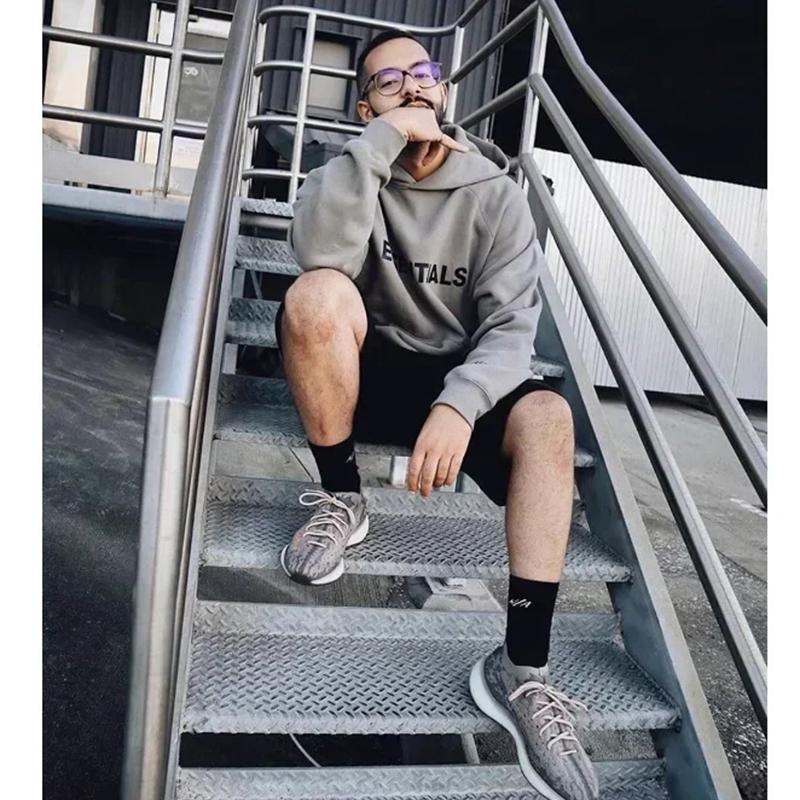 Fear of God Essentials Hoodie — 100 % Baumwolle, lockere Passform, Kängurutasche - Desfino
